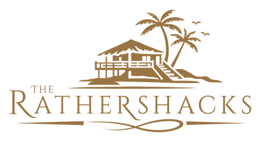 The new The Rather Shacks logo: a gold shack and palms emblem above a serif wordmark